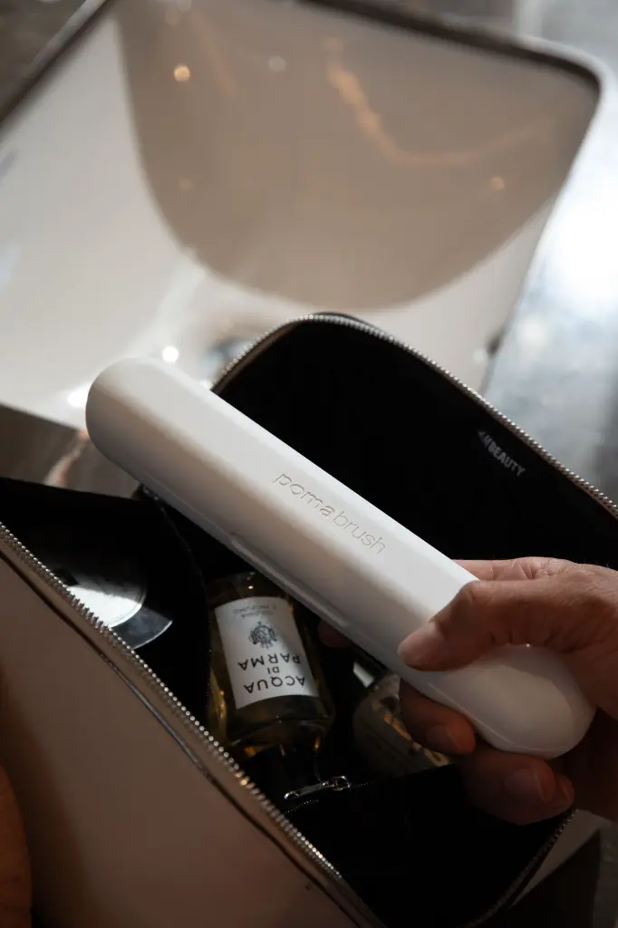 pomabrush white in toiletries bag.webp