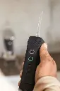 man hands holding pomafloss black.webp